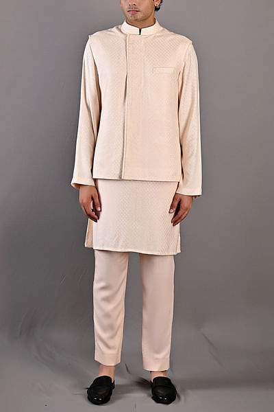 Peach textured kurta and Nehru jacket set