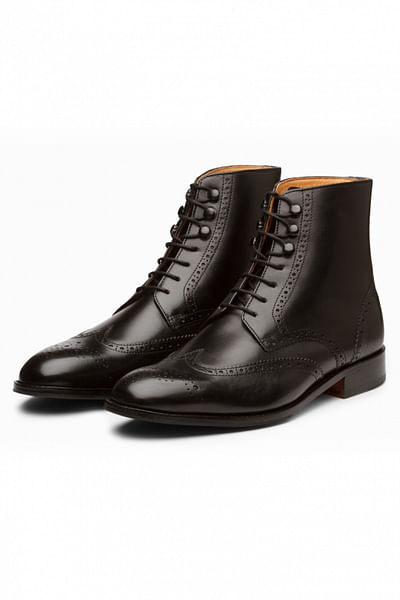 Black perforated brogue boots