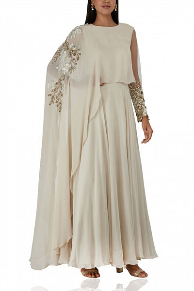Ivory embellished gown with attached cape