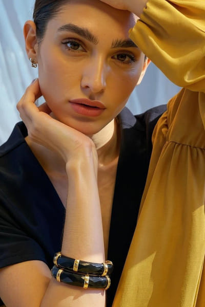 Gold plated black glass bangle bracelet