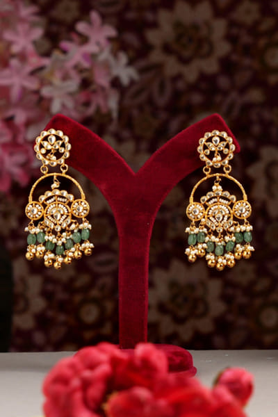Green stone embellished earrings
