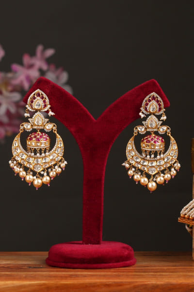 Pink stone encrusted drop earrings