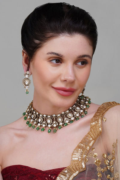 White kundan and green beaded necklace set