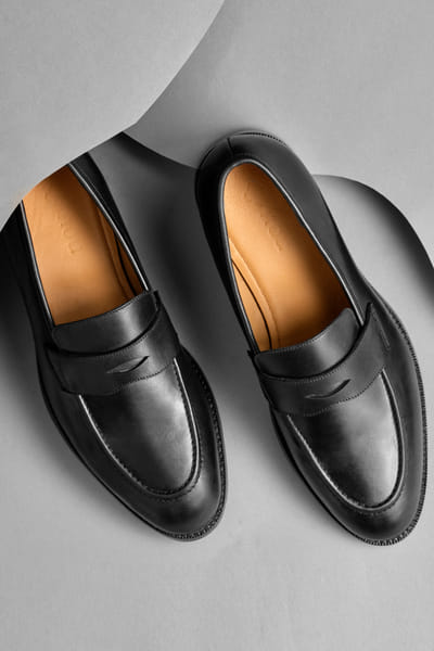 Black leather moccasin shoes