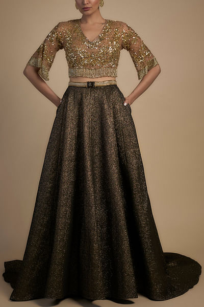 Black lehenga and gold blouse