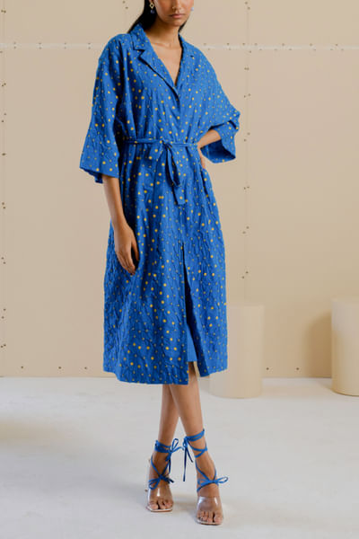 Blue and yellow polka print smocked wrap dress