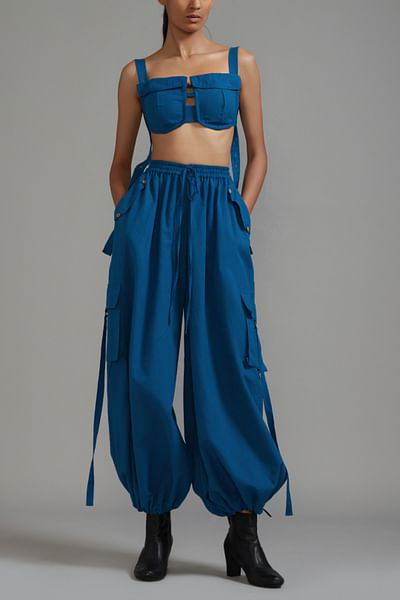 Blue bralette and cargo pants