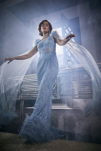 Blue embroidered fur accented gown