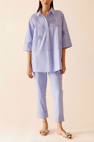 Blue floral embroidery and pintuck top