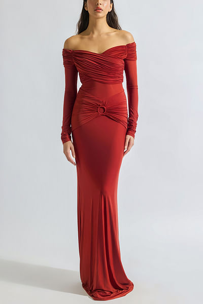 Brick red draped off-shoulder gown
