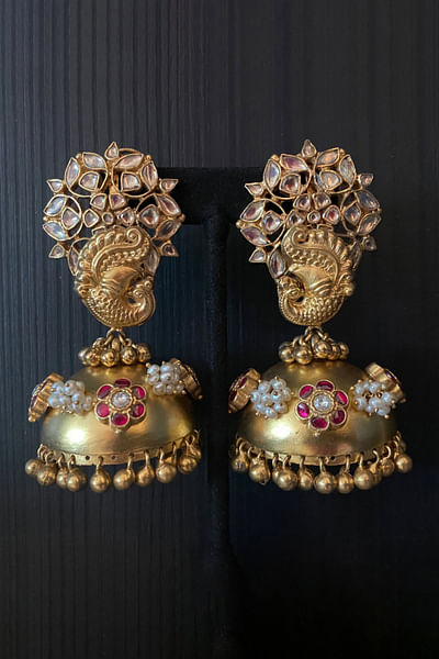 Gold and red peacock kundan and pearl jhumkas