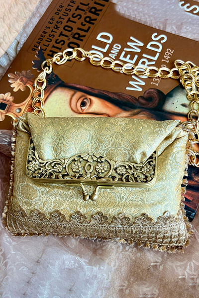 Gold brocade clutch-style potli bag