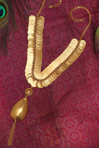 Gold coin embellished necklace