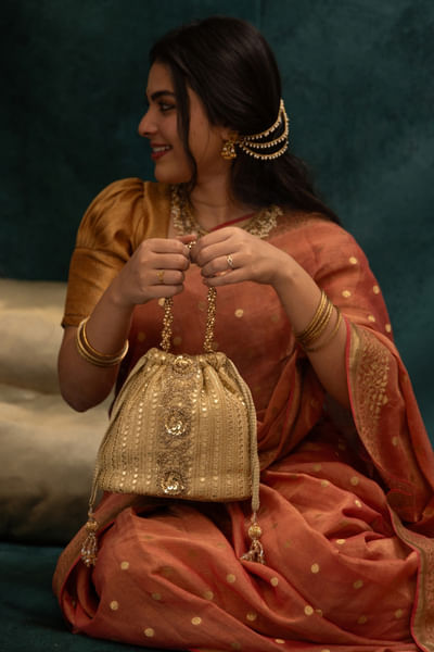 Gold embroidered bucket bag
