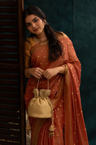 Gold embroidered potli bag