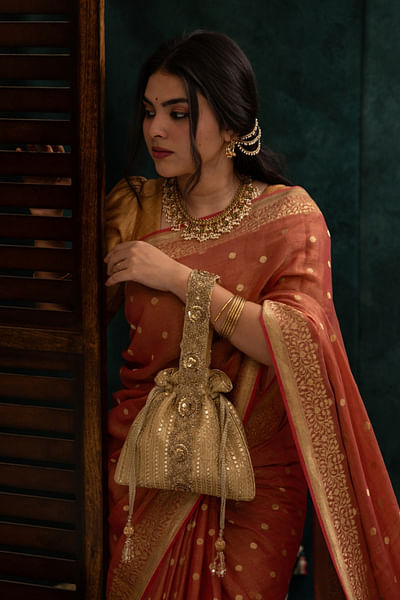 Gold embroidered tassel potli bag