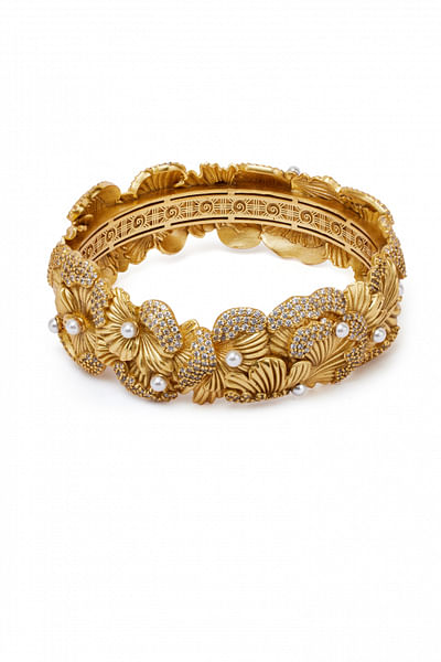 Gold floral motif statement bangle