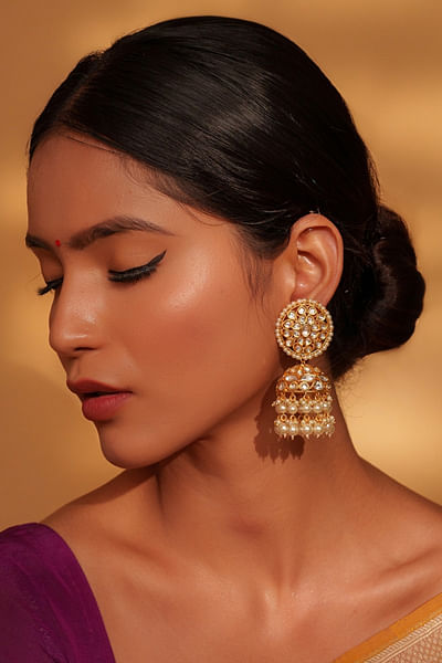 Gold kundan embellished polki jhumkas