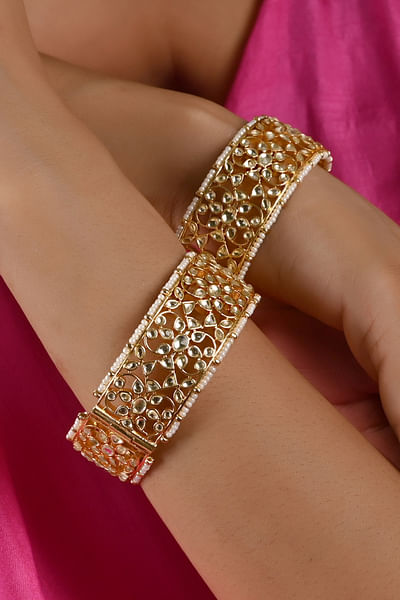 Gold pearl and kundan bangles