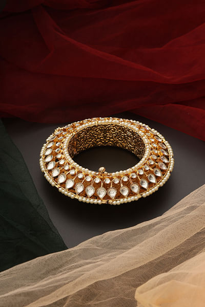 Gold polki and pearl kada