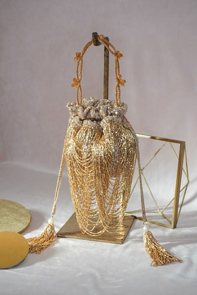 Gold sequin and cutdana layered potli bag