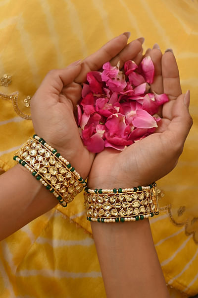 Green and gold kundan and pearl bangles