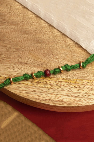 Green chandan bead thread rakhi