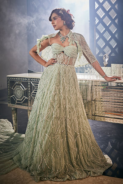 Green embroidered gown and cape