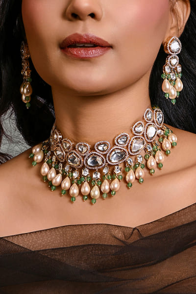 Green kundan polki and pearl choker set