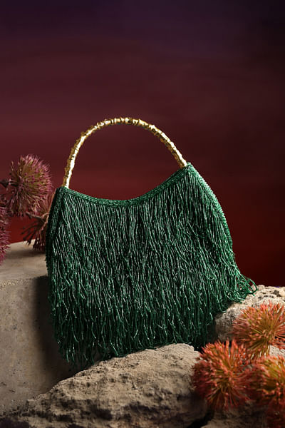 Green tasselled handbag