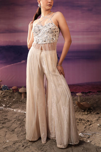 Ivory embroidered corset top and flared pants