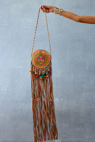 Yellow floral printed tasselled sling bag