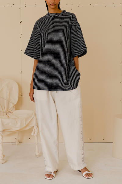 Off-white cutwork pants