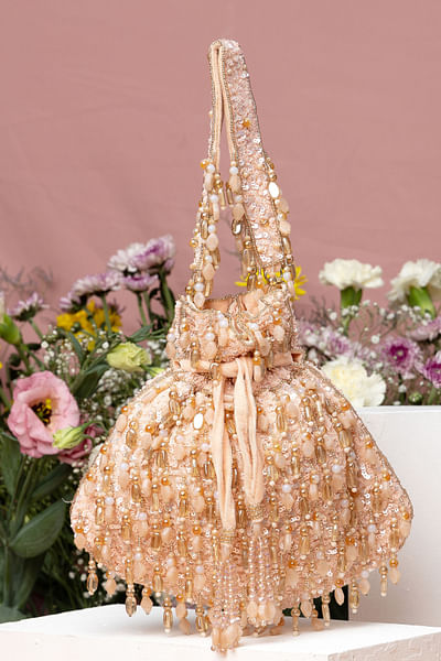 Peach tassel embellished potli bag
