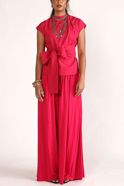 Pink pleated flared pants
