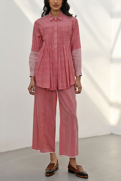 Pink smocked flared shirt