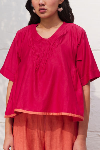 Pink smocked top