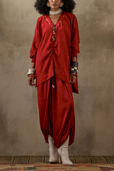 Red tasselled top and skirt
