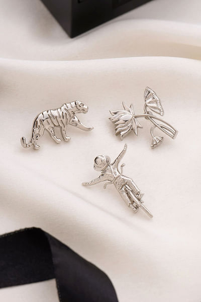 Silver floral and tiger brooch gift set