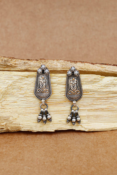 Silver floral carved oxidised earrings