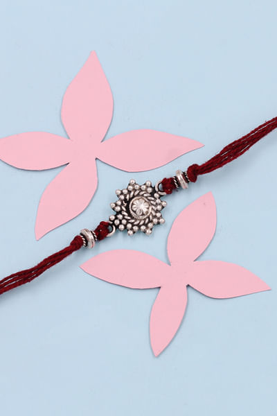Silver geometric and floral thread rakhi
