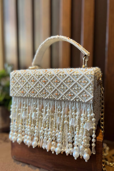 White and peach geometric bead tassel box clutch