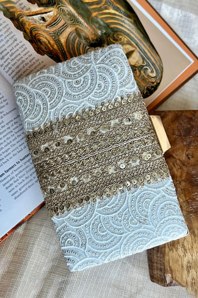 White embroidered clutch