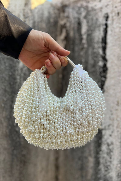 White pearl tasselled crescent mini handbag