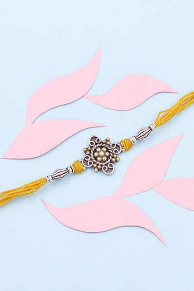 Yellow and gold embellish thread rakhi