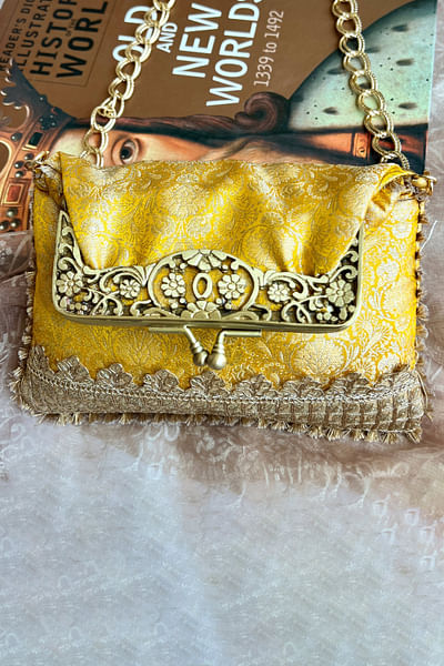 Yellow brocade clutch-style potli bag