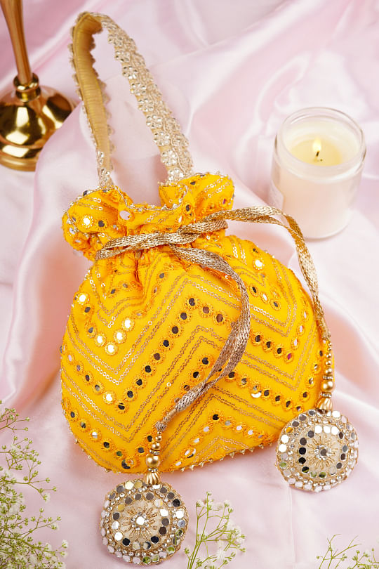 Buy Mustard yellow chevron potli bag by Punit Balana at Aashni and Co