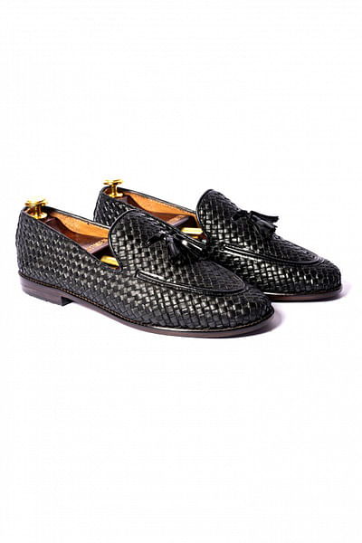 Black tassel accented loafers