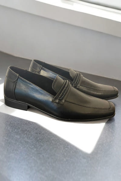 Black woven detail loafers