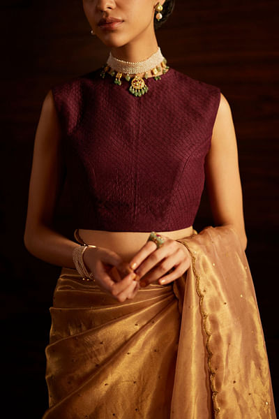 Burgundy quilted sleeveless woven blouse